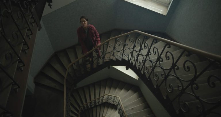 Short film SCHRATZ poster depicting a woman in a staircase.