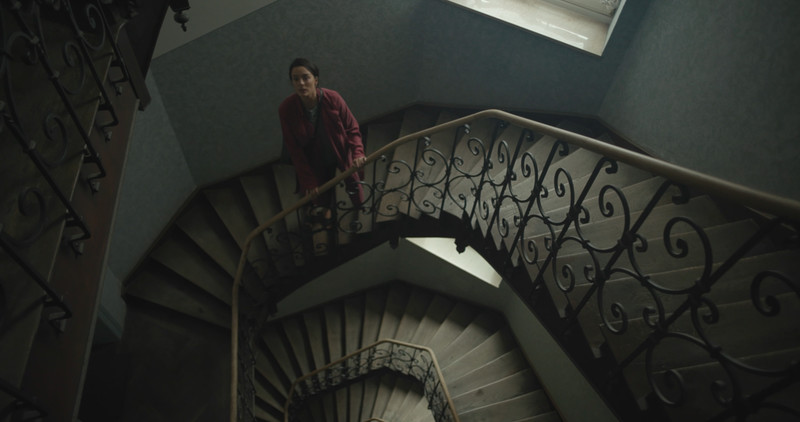 Short film SCHRATZ poster depicting a woman in a staircase.